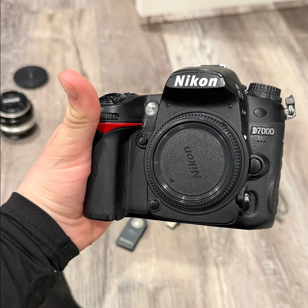 Nikon DSLR D7000 Camera with Black Battery Grip and Accessories